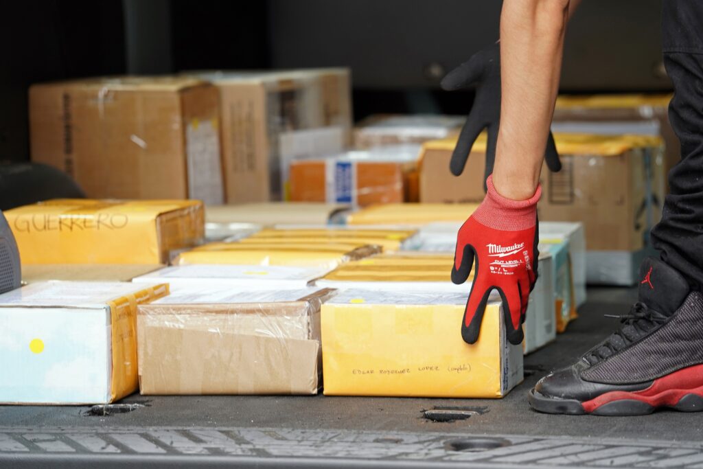 A man loads boxes containing the cremated remains of 250 Mexicans who had died from COVID-19 into a van outside St. Patrick's Cathedral in New York City following a July 11, 2020, prayer service during which the ashes were blessed by New York Cardinal Timothy M. Dolan.