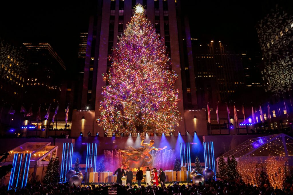 People in New York City watch the 89th lighting of the Rockefeller Center Christmas Tree December 1, 2021. A Catholic family in the Diocese of Wilmington, Delaware, donated the 79-foot-tall, 46-foot-wide Norway spruce for that year's display.