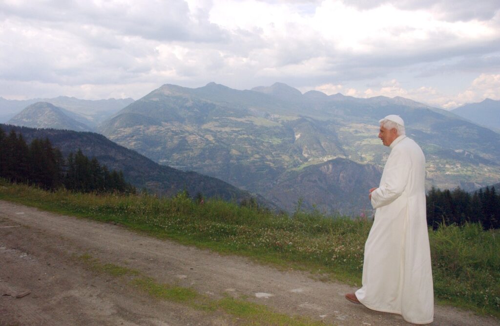 Pope Benedict XVI walks on a path during his summer retreat at Les Combes in the northern mountains of Italy in 2006.