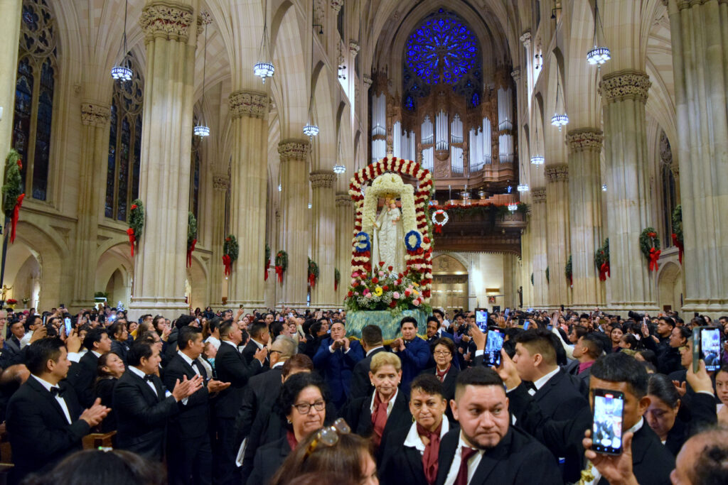 A statue of Our Lady of Nube is carried into the sanctuary of St. Patrick's Cathedral, December 17, 2023.