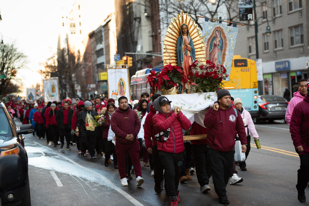 Members of the faithful carry a statue and images of Our Lady of Guadalupe to St. Patrick's Cathedral, ahead of the annual Mass there on Her feast day, December 12, 2023.