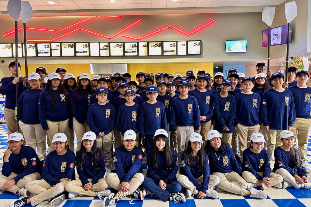 The entire San Miguel Academy Rowing team, which is now 100% of the student body, attends an early screening of Boys in the Boat at Regal Fishkill