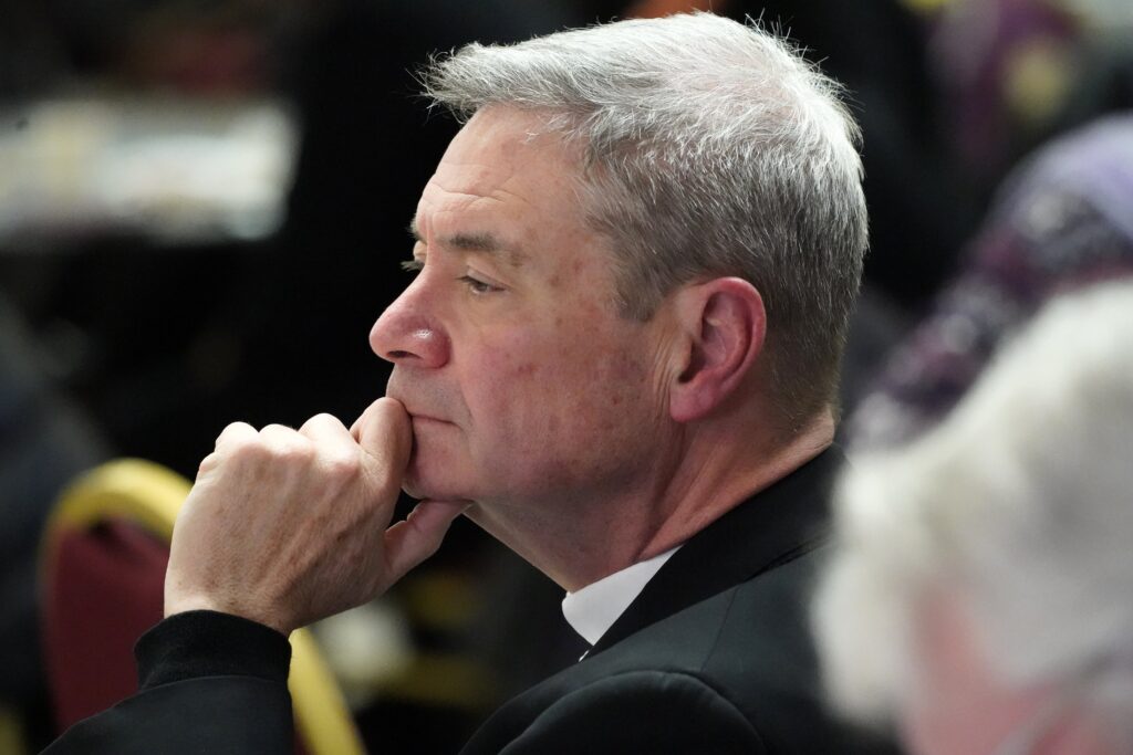 Bishop Robert J. Brennan of Brooklyn is seen attending a roundtable discussion on racism and other issues of concern to Black Catholics prior to a prayer service in honor of the life and legacy of the Rev. Martin Luther King Jr. at St. Kevin Church in the Flushing section of Queens, January 16, 2023.