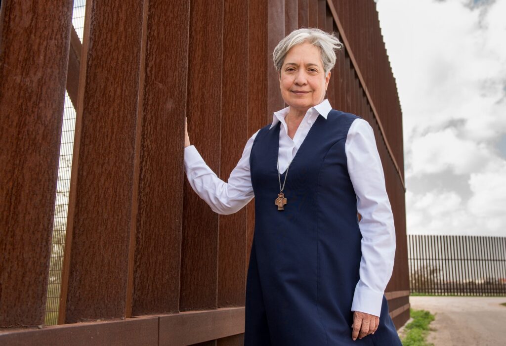 Sister Norma Pimentel, a member of the Missionaries of Jesus, is pictured along a border wall between Texas and Mexico in 2018.