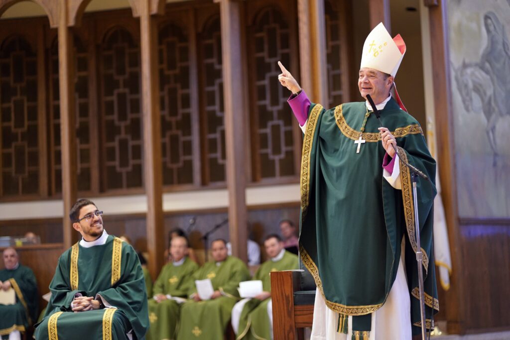 Bishop Robert J. Brennan of Brooklyn addresses the congregation as he celebrated a send-off Mass at Immaculate Conception Center in Douglaston, July 23, 2023, for pilgrims from the Diocese of Brooklyn who were attending World Youth Day in Lisbon, Portugal, August 1-6. The diocese was represented by more than 300 pilgrims at the event.