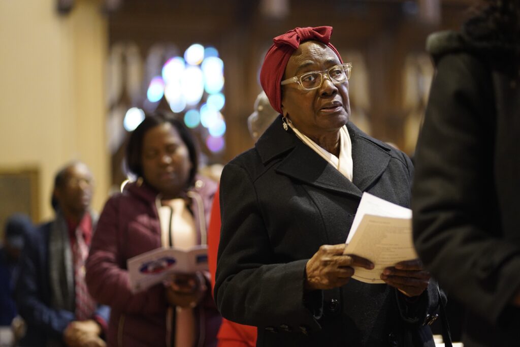 Worshippers pray during a Mass marking Haitian Independence Day at St. Agnes Cathedral, January 1, 2024, the feast of Mary, Mother of God.