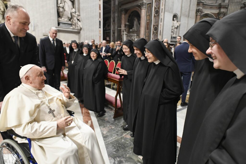 Pope Francis greets a community of Benedictine nuns from Argentina before Mass in St. Peter's Basilica at the Vatican on January 6, 2024.