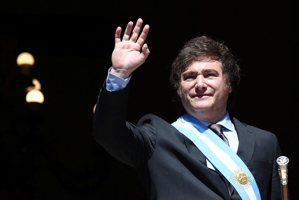 Argentine President Javier Milei waves to supporters from the Casa Rosada balcony, after his swearing-in ceremony, in Buenos Aires December 10, 2023.