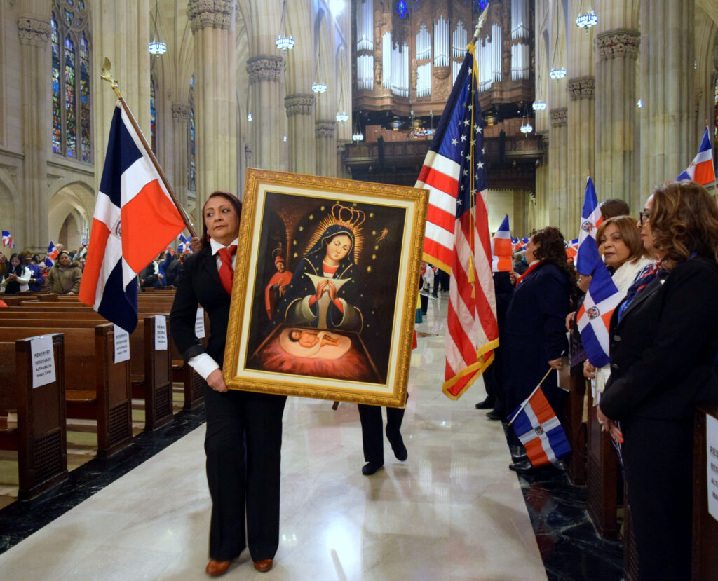 An image of Our Lady of Altagracia leads a procession into St. Patrick's Cathedral, during the Our Lady of Altagracia Mass in 2019.