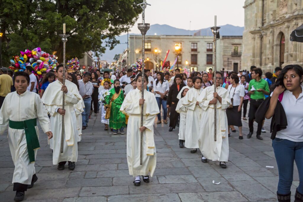 Altar servers lead a procession in celebration of "Dia de la Candelaria," or Candlemas Day, February 2 in Oaxaca, Mexico. Also known as the feast of the Presentation of the Lord, the day's Mass includes a special rite for the blessing of candles used in sacred liturgies.