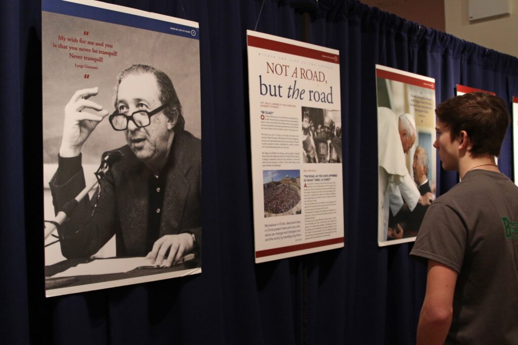 A man looks at an exhibit in New York City on January 14, 2017, on the life and teachings of Monsignor Luigi Giussani, founder of the worldwide Catholic lay ecclesial movement Communion and Liberation.