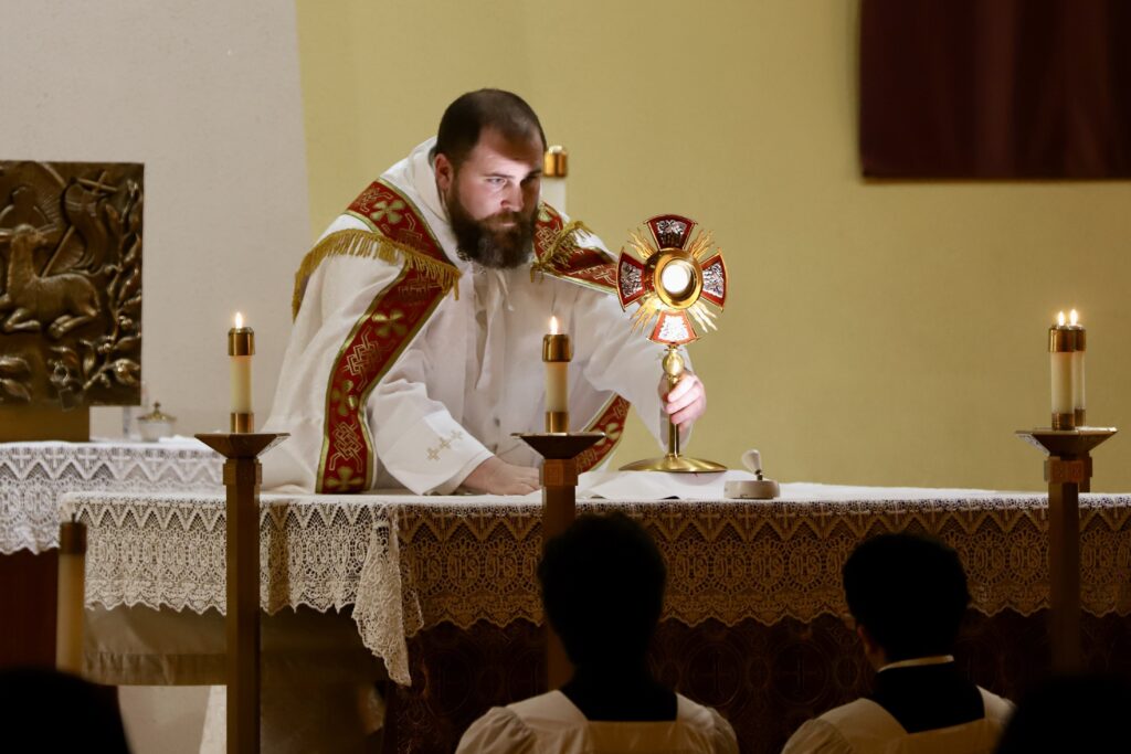 Dominican Father Patrick Hyde, a National Eucharistic Revival preacher, presides over Eucharistic Adoration during a youth and family retreat March 23, 2023, at St. Anthony of Padua Church, St. Mary of Mount Carmel Parish, in Hammonton, New Jersey.
