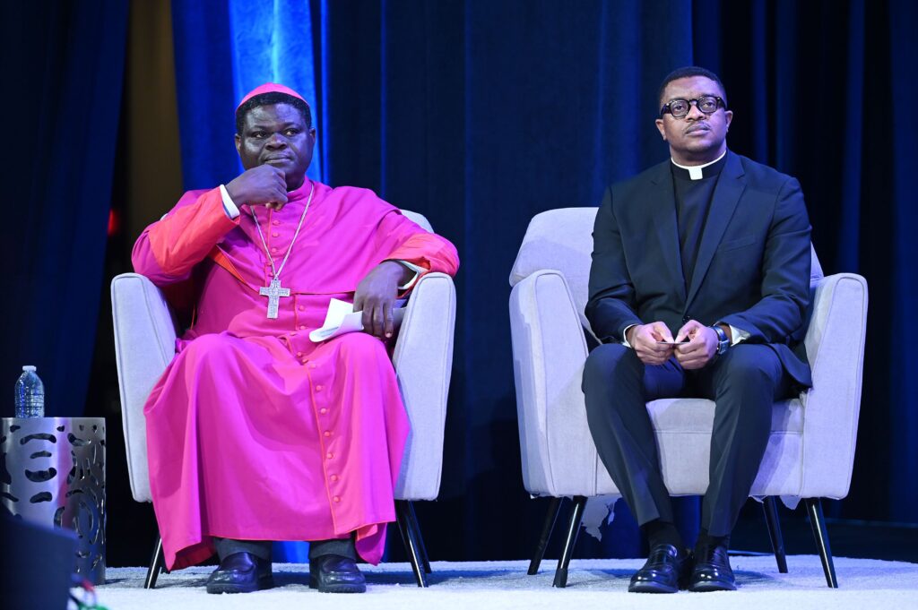Nigerian Bishop Wilfred Chikpa Anagbe of Makurdi and Nigerian Father Degi Dada of Ondo listen during the National Catholic Prayer Breakfast in Washington February 8, 2024.