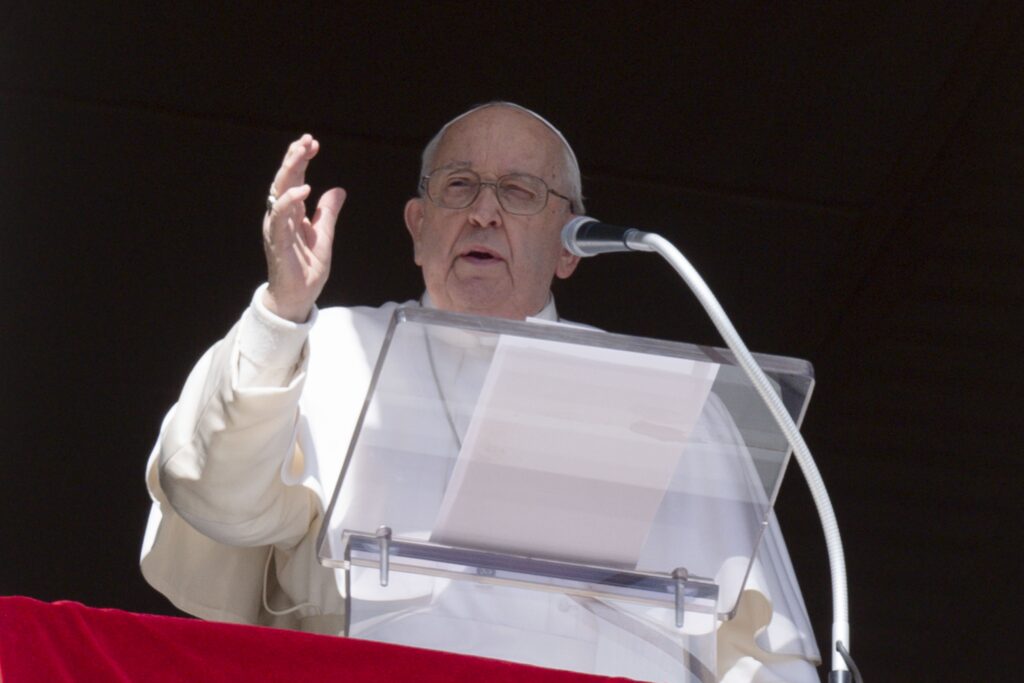 Pope Francis gestures as he leads the recitation of the Angelus prayer with visitors in St. Peter's Square at the Vatican February 25, 2024, and prays for peace in Ukraine two years after Russia launched its major offensive on the country.