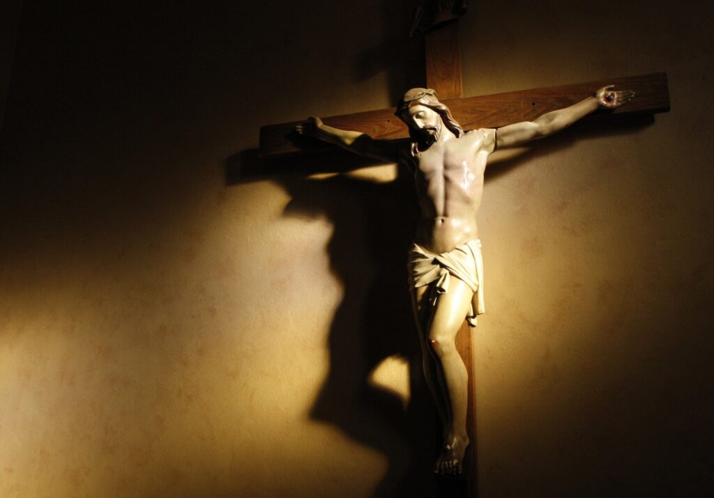 Evening light shines on a crucifix in the vestibule of St. Paul's Basilica in Toronto in this 2008 photo. By recognizing the great status of Holy Week and Easter, the ancient church made it clear how important the liturgy, "the work of the people," is for us all.