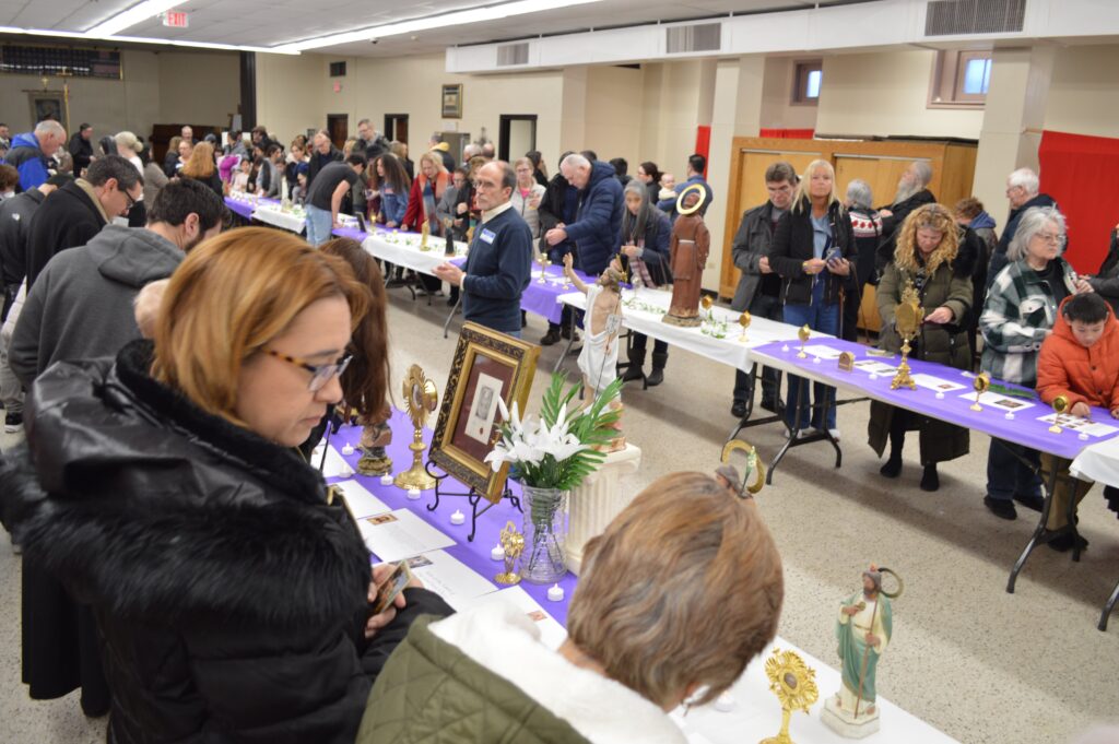 Visitors look at a display of 200 relics at Our Lady of Mount Carmel Oratory in Montclair, New Jersey, on February 24, 2024.