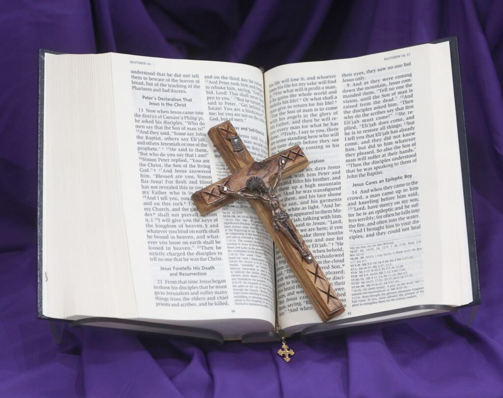 A crucifix and Bible are pictured on purple cloth during Lent at Jesus the Good Shepherd Church in Dunkirk, Maryland, April 7, 2022.