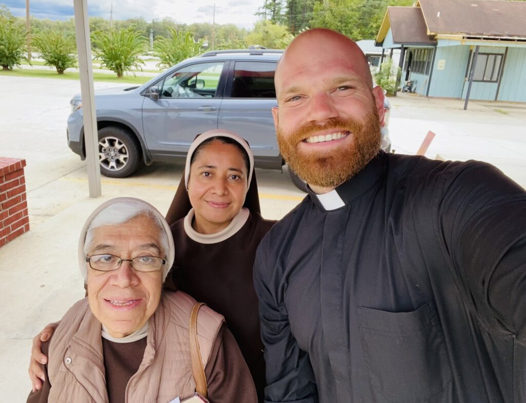 Father Joseph Friend of the Diocese of Little Rock, Arkansas, is pictured in an undated photo with Carmelite Sisters Hermana Elsa Miranda, front, and Hermana Yolanda Padrón-Serrano.