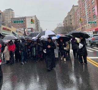 Parishioners from five Washington Heights churches braved cold and heavy rain to participate in their annual Stations of the Cross procession.