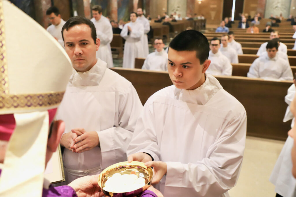 Ian Paul Christopher Mendoza (right, holding paten) was one of 25 seminarians to receive the Ministry of Acolyte at Ministry of Acolyte in the Chapel of the Immaculate Conception at the Pontifical North American College, Vatican City, on March 3, 2024.