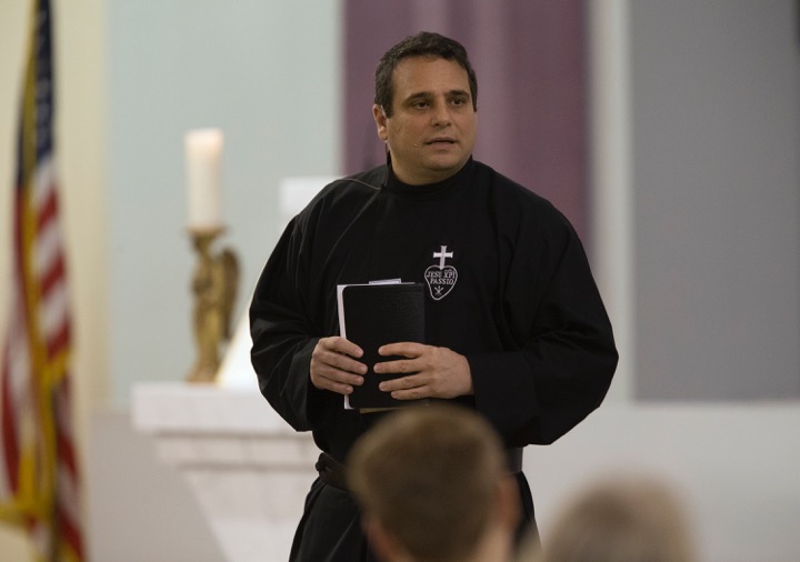 Father Enzo Del Brocco, C.P., delivering a homily.