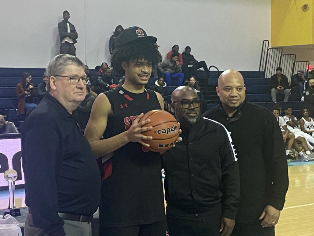 Archbishop Stepinac High School senior Braylan Ritvo (holding basketball) received the Most Valuable Player award during Stepinac’s 75-64 win over Brooklyn’s Eagle Academy in the NYC: Public School Athletic League (PSAL) versus Catholic High School Athletic Association (CHSAA) Champions Challenge, played March 24, 2024, at Long Island University’s Brooklyn campus.