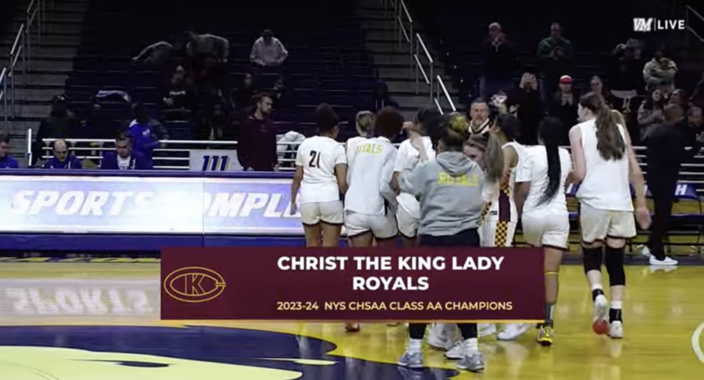 Members of the Christ The King High School Lady Royals basketball team celebrate following their 85-63 state championship victory over St. Joseph by the Sea.