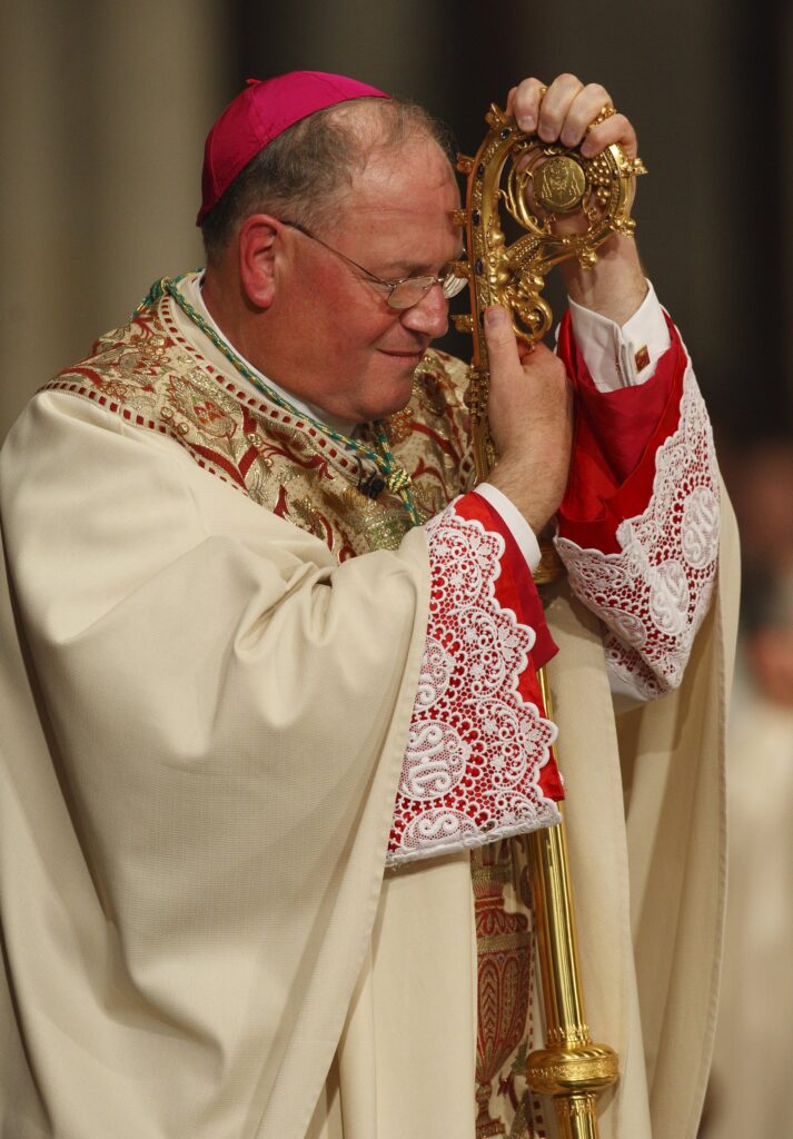 Archbishop Timothy M. Dolan leans against his pastoral staff during the reading of the Gospel during his installation Mass at St. Patrick's Cathedral in New York April 15. Archbishop Dolan, 59, became the 10th archbishop of New York, succeeding Cardinal Edward M. Egan. (CNS photo/Paul Haring) (April 16, 2009) See DOLAN-INSTALL April 16, 2009.