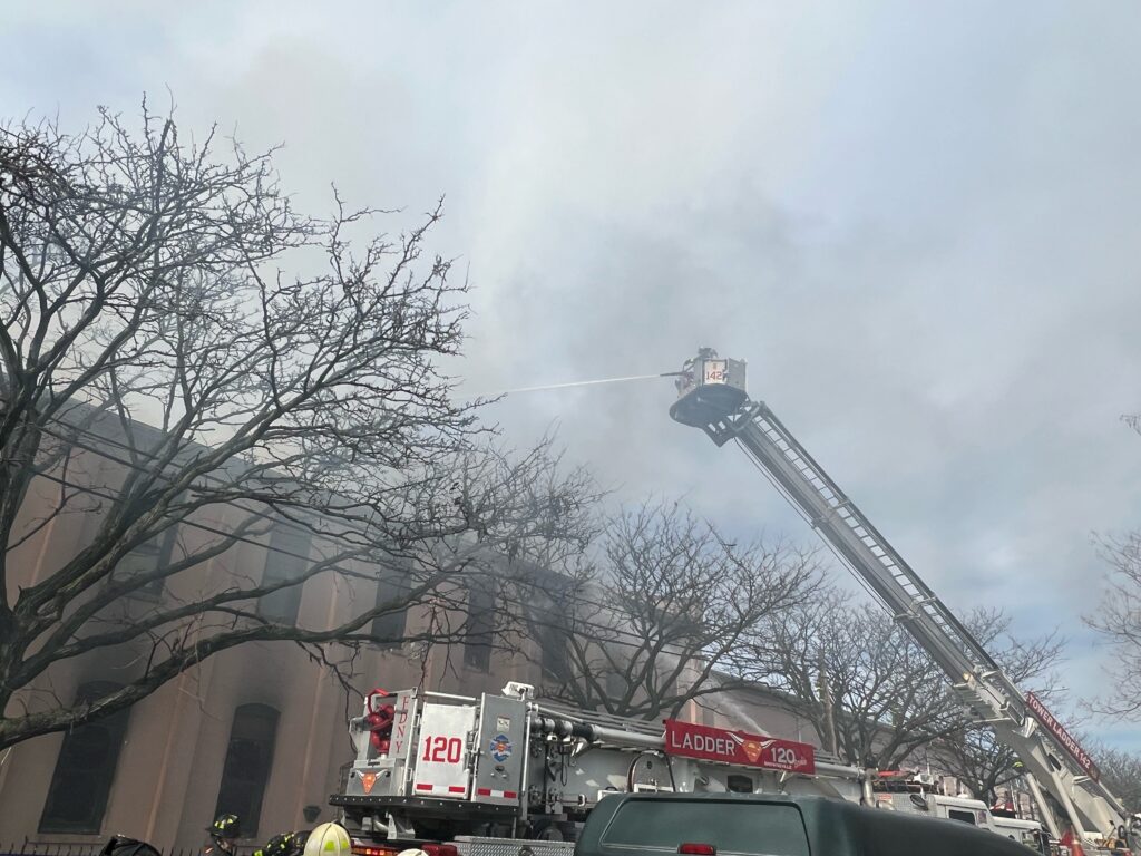 Firefighters work to extinguish a five-alarm fire that broke out in Our Lady of the Rosary of Pompeii Church in Brooklyn, New York's East Williamsburg neighborhood during Easter Mass March 31, 2024.