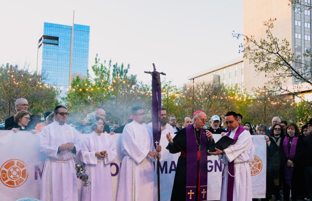 Bishop Mark J. Seitz of El Paso, Texas, leads the community in prayer at the march “Do Not Be Afraid: March and Vigil for Human Dignity” before hundreds process toward Sacred Heart Church in El Paso for a prayer vigil for the respect of migrants’ rights on March 21, 2024. Monsignor Kevin Sullivan (right, with white baseball cap), executive director of Catholic Charities of the Archdiocese of New York, participated in the rally and march.