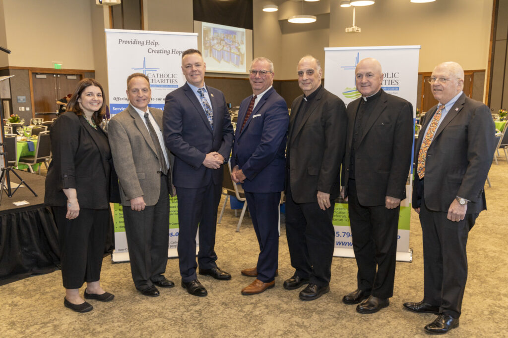 Pictured (l-r) are Catholic Charities CEO Shannon Kelly; honorees Michael Schoendorf, Vice President of Operations for ShopRite Supermarkets; Port Jervis Police Chief William Worden; Ulster Savings Bank CEO William Calderara; Fr. Bob Porpora of St. Peter’s, Monticello; Fr. Joseph Tokarcyzk of Sacred Heart, Highland Falls; and Catholic Charities Board Chair, Thomas Strahle. Photo courtesy of Catholic Charities of Orange, Sullivan, and Ulster.