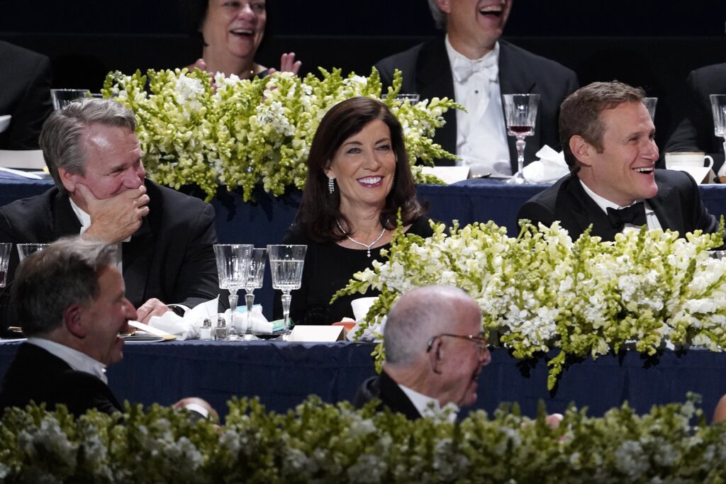 New York Gov. Kathy Hochul (center) smiles as she attends the 77th annual Alfred E. Smith Memorial Foundation Dinner at the Park Avenue Armory in New York City on October 20, 2022.