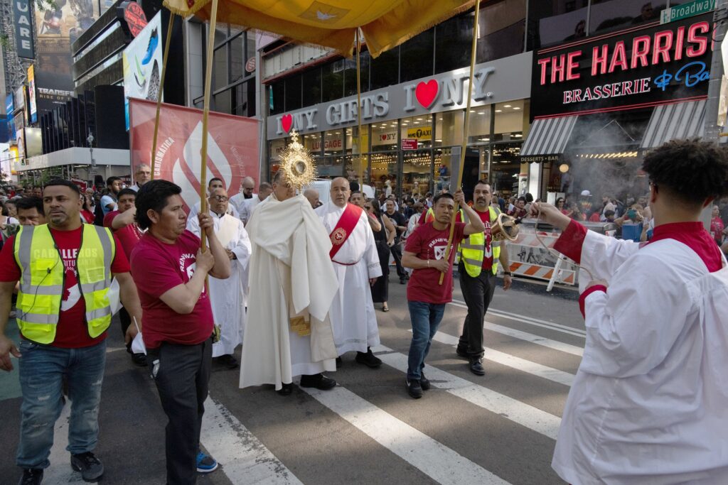 A clergyman carries a monstrance in a Eucharistic procession through the Manhattan borough of New York City to St. Patrick's Cathedral for a Pentecost Vigil May 27, 2023. The National Eucharistic Pilgrimage launches from four points in the U.S. May 18-19, 2024, and converges eight weeks later in Indianapolis for the July 17-21 National Eucharistic Congress.