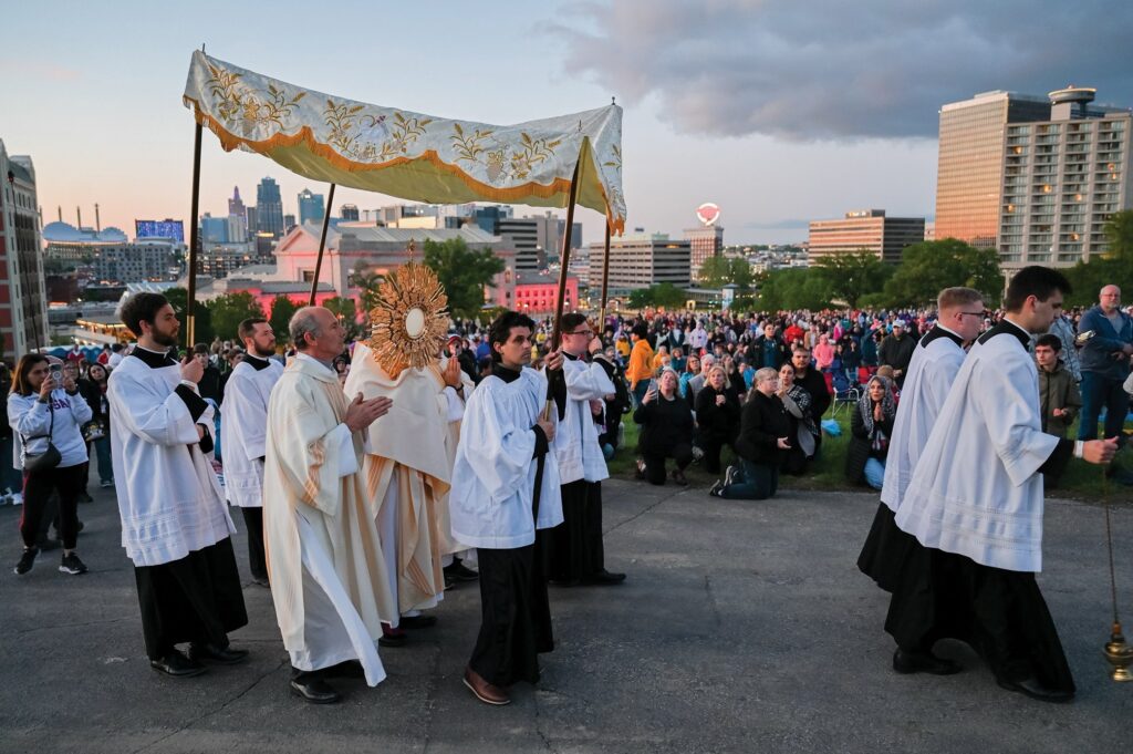 Bishop James V. Johnston Jr. of Kansas City-St. Joseph, Mo., leads a short Eucharistic procession on an overlook at the National World War I Museum and Memorial in Kansas City, Mo., May 4, 2024, for Behold KC.