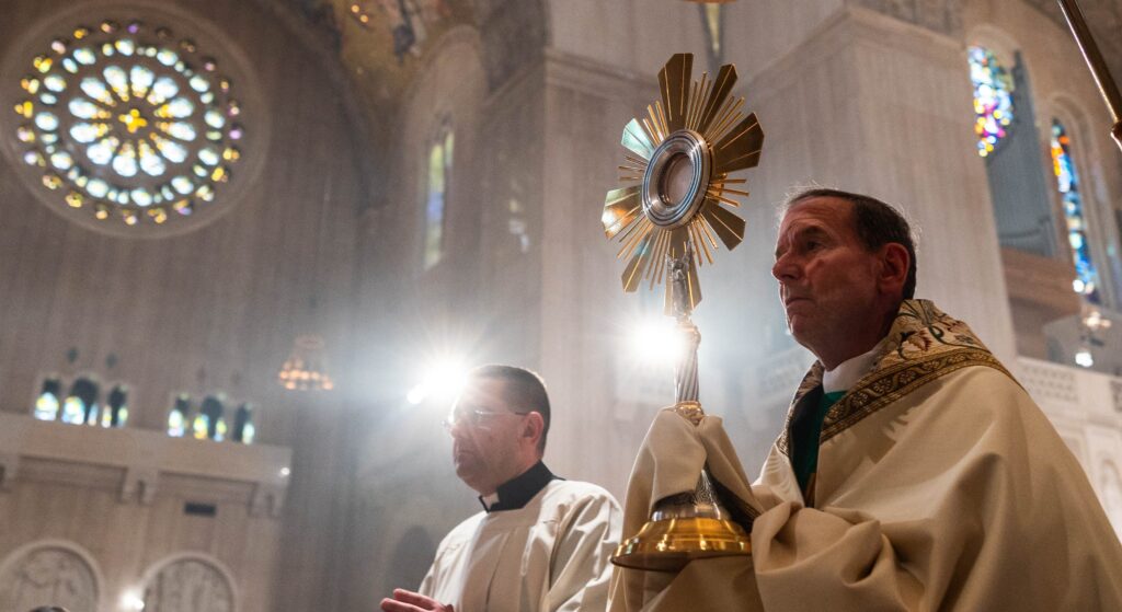 Bishop Michael F. Burbidge of Arlington, Virginia, leads a Eucharistic procession inside the Basilica of the National Shrine of the Immaculate Conception in Washington during the National Eucharistic Pilgrimage Mass on June 9, 2024.