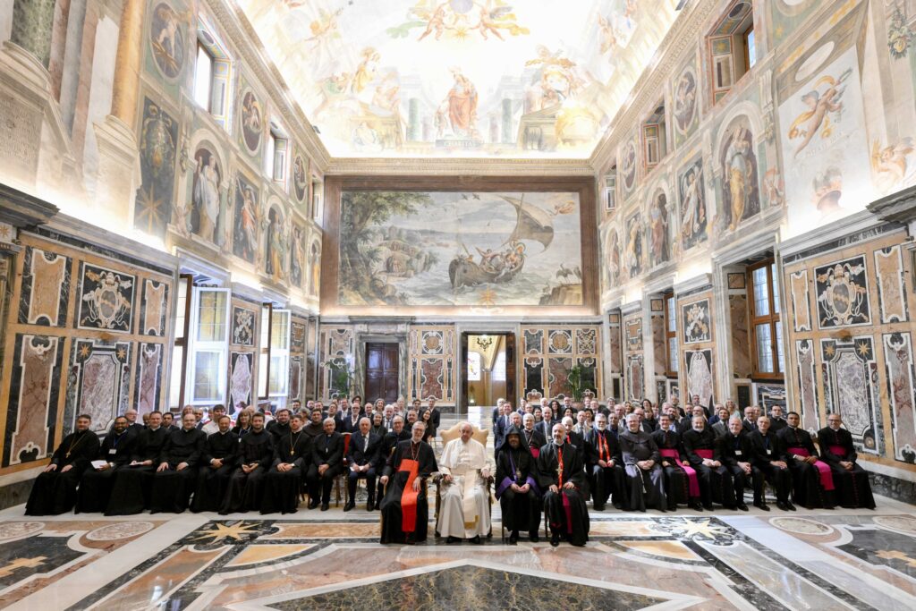Pope Francis poses for a photo with participants in the general assembly of the Reunion of Aid Agencies for the Oriental Churches (ROACO), part of the Dicastery for the Oriental Churches, during a meeting at the Vatican June 27, 2020. (CNS photo/Vatican Media)