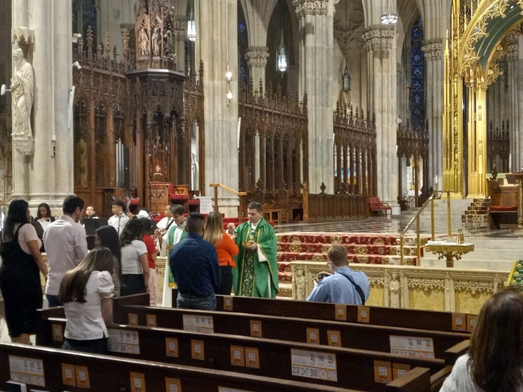 Father Christopher Argano during Holy Communion of the Young Adult Mass at St. Patrick’s Cathedral, Wednesday, June 12, 2024