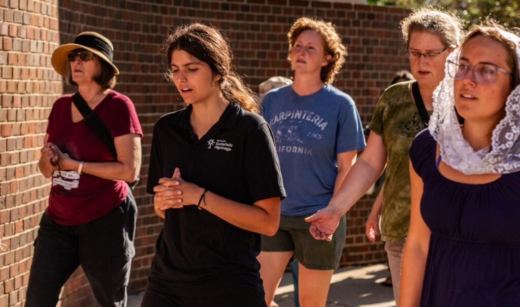 Marina Frattaroli, a perpetual pilgrim on the National Eucharistic Pilgrimage's eastern St. Elizabeth Ann Seton Route, walks in a Eucharistic procession through downtown Cincinnati July 6, 2024.