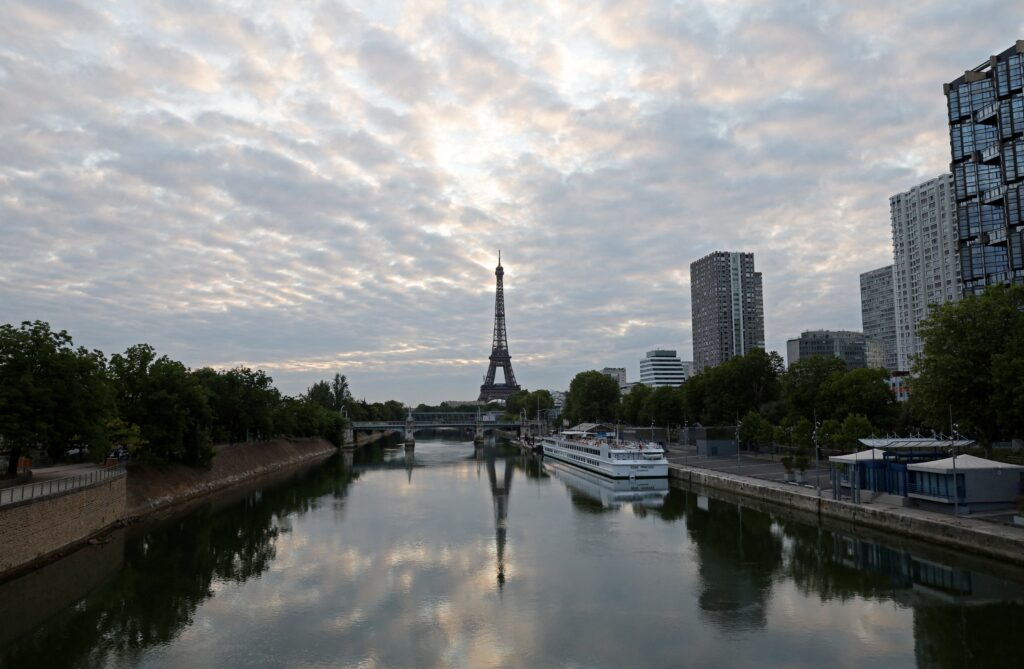 A reflection of the Eiffel Tower is seen in the Seine River in Paris July 25, 2024.