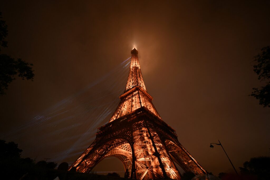 Lights illuminate the Eiffel Tower on July 26, 2024, during the opening ceremony of the Paris 2024 Olympic Games.