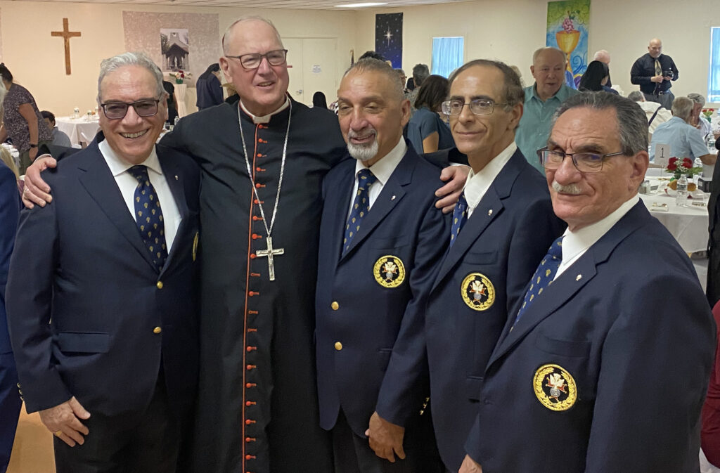 Cardinal Timothy Dolan (second left) poses with Knights of Columbus at the 100th anniversary celebration for the Church of St. Joan of Arc in Sloatsburg, July 7, 2024.