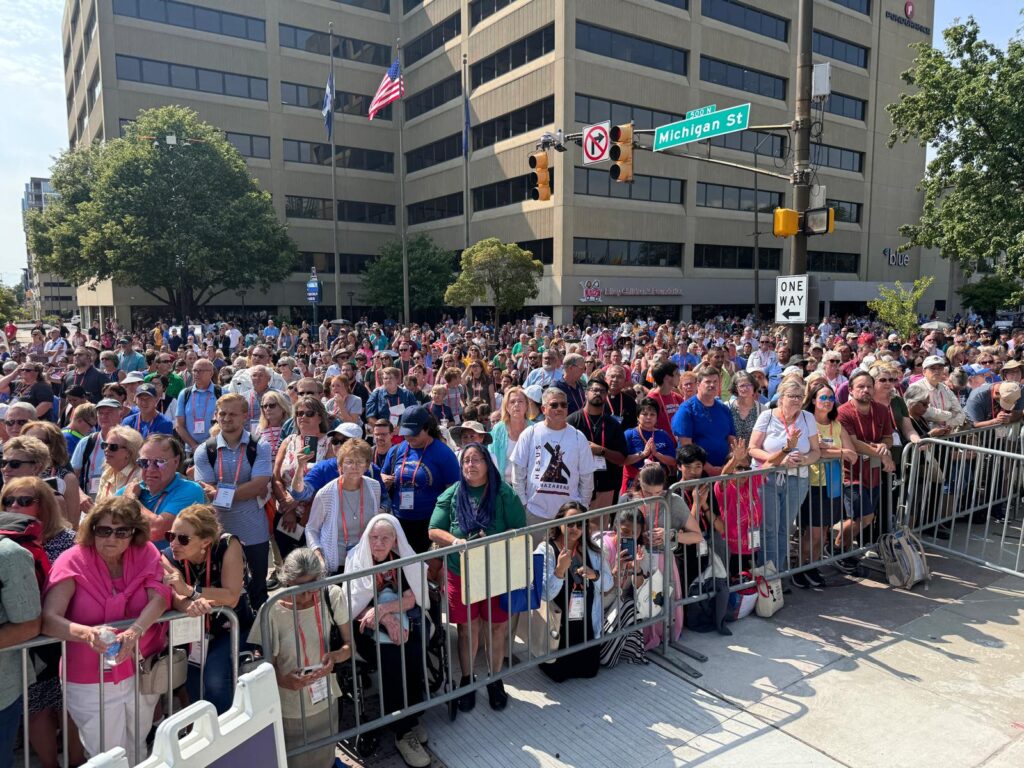 Thousands of people in gather silent adoration during the Eucharistic procession through downtown Indianapolis, July 20, 2024.