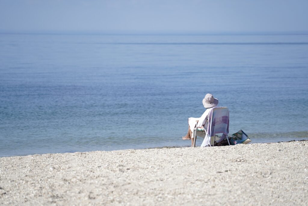 A woman is seen relaxing at West Meadow Beach in Setauket, October 2, 2023.