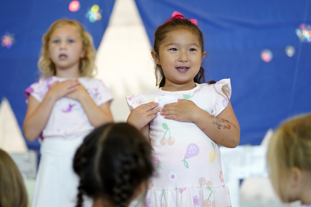 Students sing on stage during vacation Bible school at St. Mary Church in East Islip, July 17, 2024.