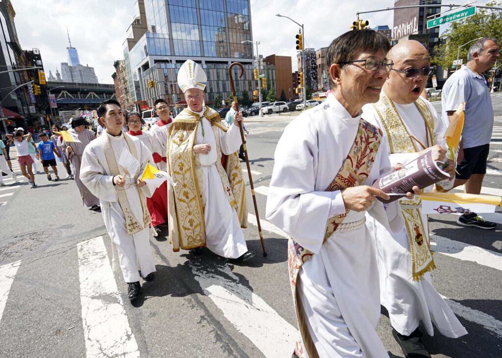 New York Auxiliary Bishop Edmund J. Whalen and other clergy participate in a Marian procession through the Chinatown and Lower East Side sections of New York City August 11, 2024.