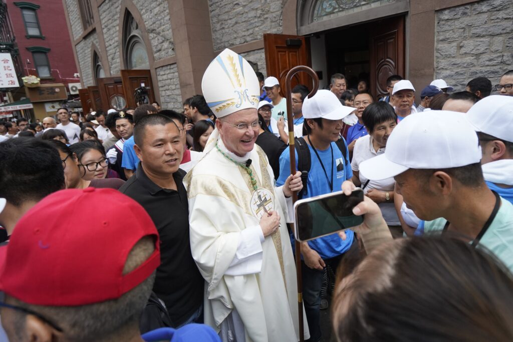 New York Auxiliary Bishop Edmund J. Whalen greets people following a bilingual English and Mandarin Mass celebrated in observance of the feast of the Assumption of Mary at Transfiguration Church in the Chinatown section of New York City on August 11, 2024.