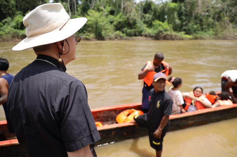 Bishop Mark J. Seitz of El Paso, Texas watches as migrants disembark at Lajas Blancas, Panama, amid their journey through that nation's Darién Gap, during the bishop's pastoral visit amid the 10th Meeting of Bishops and Migration Pastoral Agents of North America, Central America and the Caribbean, which took place August 19-23, 2024, in Panama.