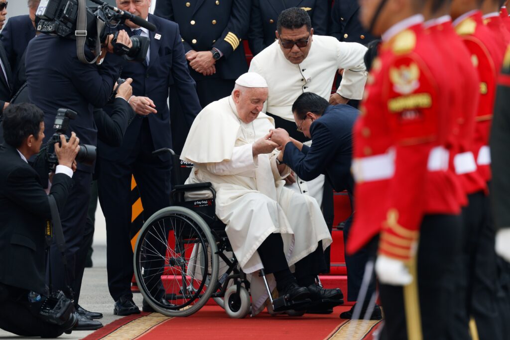 Pope Francis is greeted by Indonesian government and church leaders upon his arrival at Soekarno-Hatta International Airport in Jakarta, Indonesia, September 3, 2024.