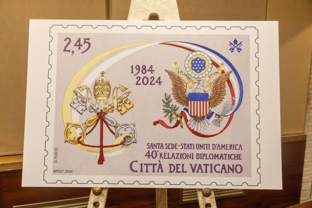 A large placard representing a new Vatican commemorative stamp celebrating the 40th anniversary of full diplomatic relations between the United States and the Holy See is presented at a news conference at the Vatican Museums September 16, 2024.