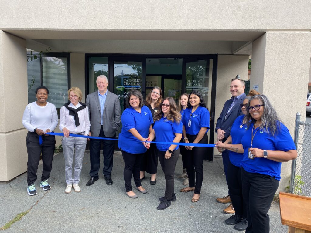 Local officials and Catholic Charities staffers cut the ribbon on the organization's new office in Monticello, in this undated handout photo from Catholic Charities of New York.